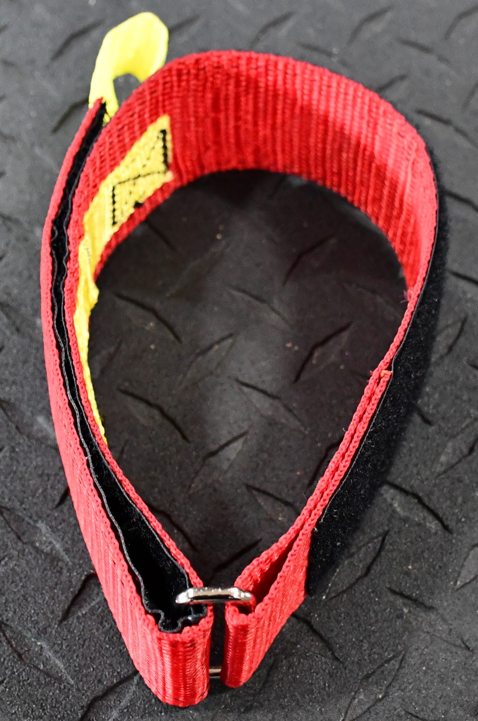 Image of the 24” Individual Hose Strap (Red) - FFHS-R24 in action, successfully bundling a fire hose strap with ease.