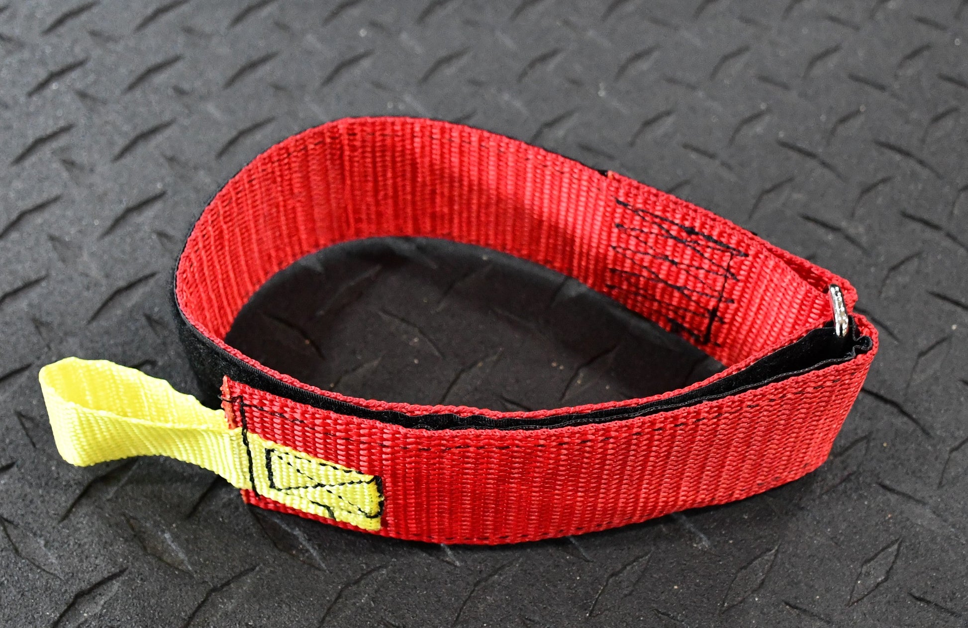 Detailed view of the 24” Individual Hose Strap (Red) - FFHS-R24 demonstrating its precision design for fire hose strap organization.