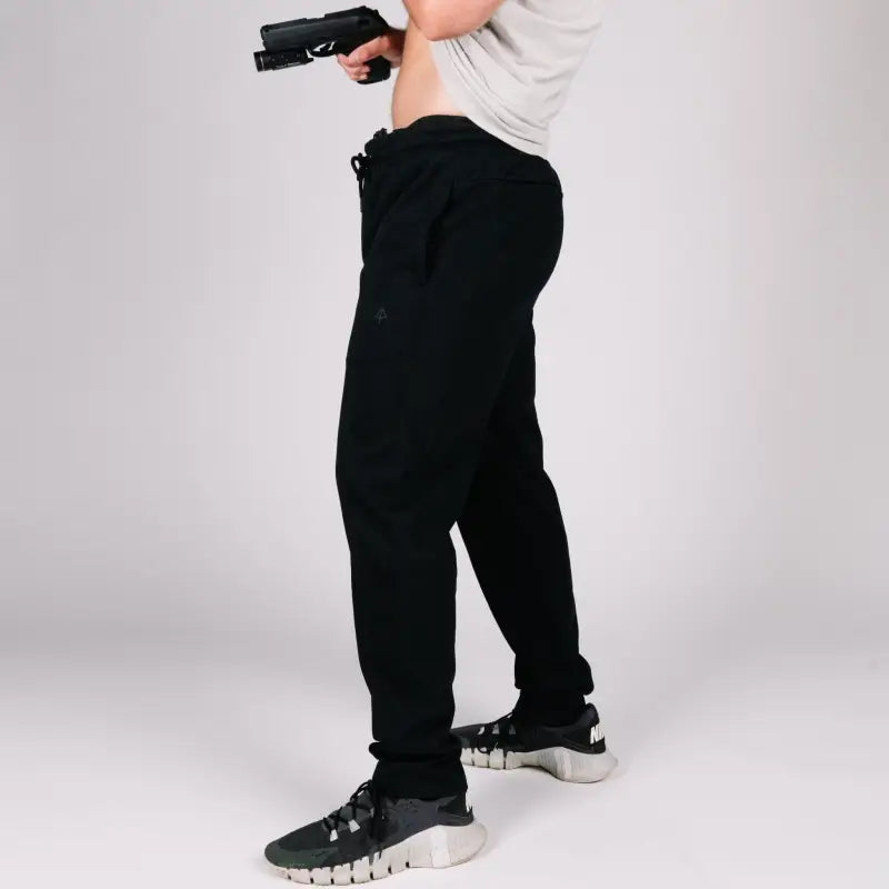 Black athletic pants with patented Carrier Retention Waistband for secure fit
