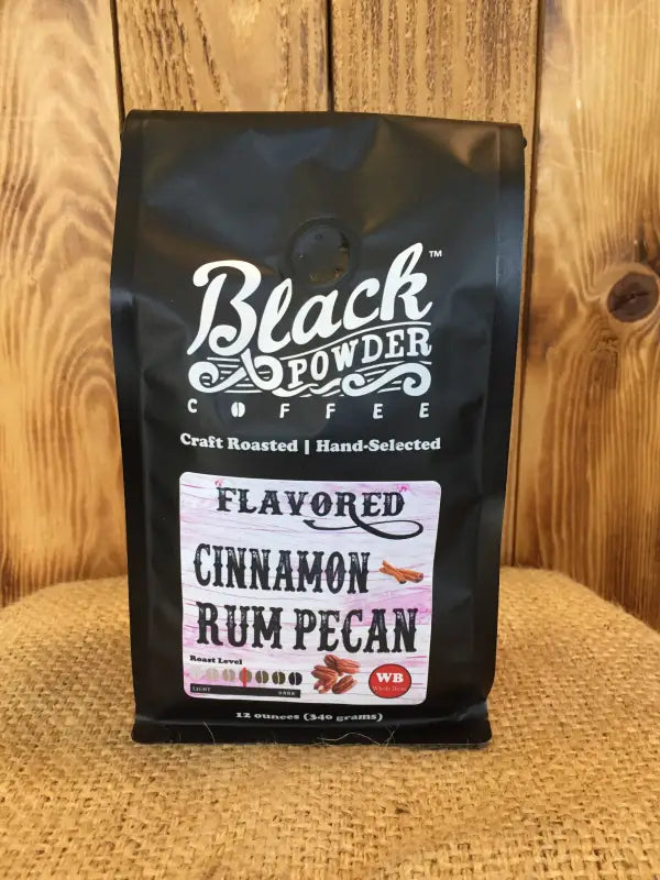 Black bag of Cinnamon Rum Pecan Flavored Coffee for rich cinnamon rum pecan taste