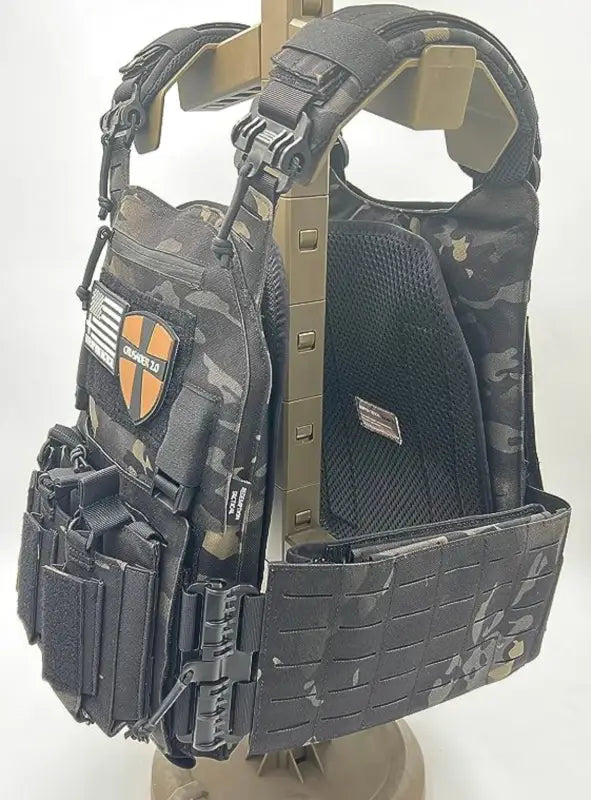 Black camouflage tactical plate carrier with molle webbing and pouches from Redemption Tactical