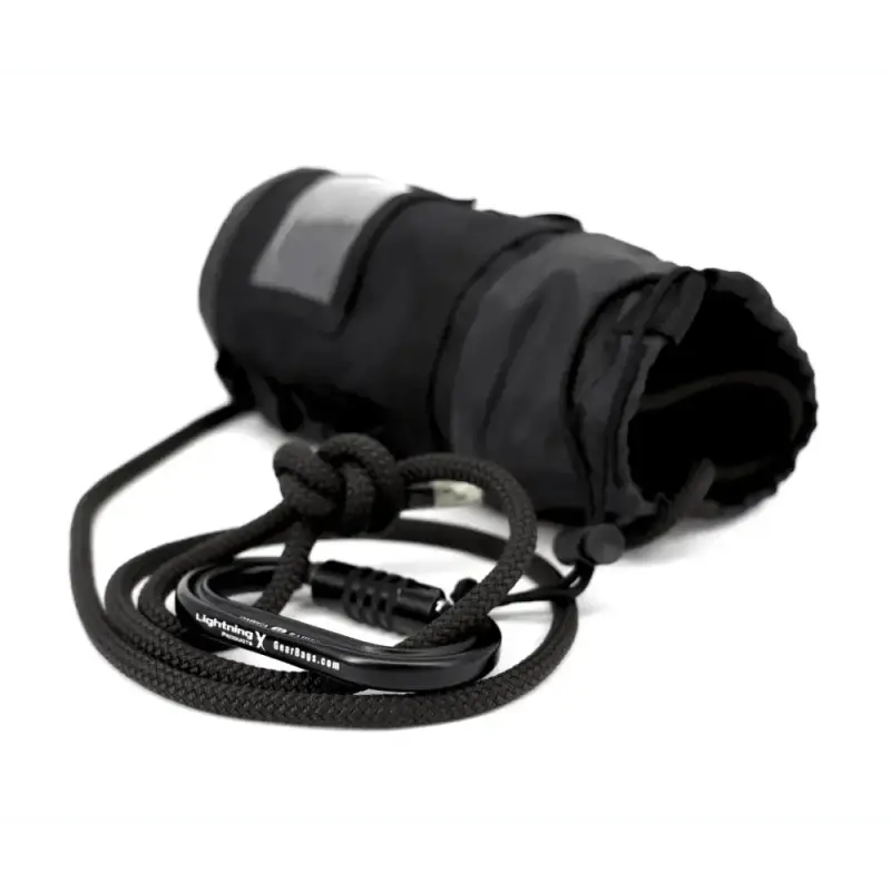 Black cylindrical camera lens warmer with power cord in Personal Rope + Bailout Kit