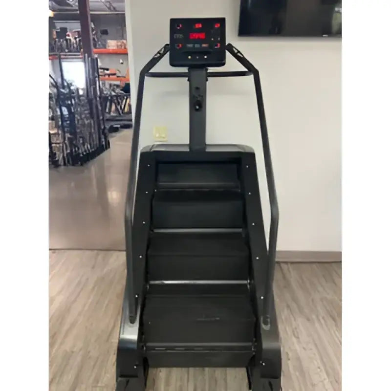 Black SFE Stepmill Pro featuring revolving staircase and performance monitor for natural climbing motion