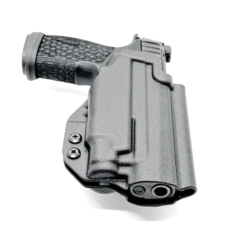 Black Sig Sauer P365-FUSE with light mounted in a black Kydex OWB holster