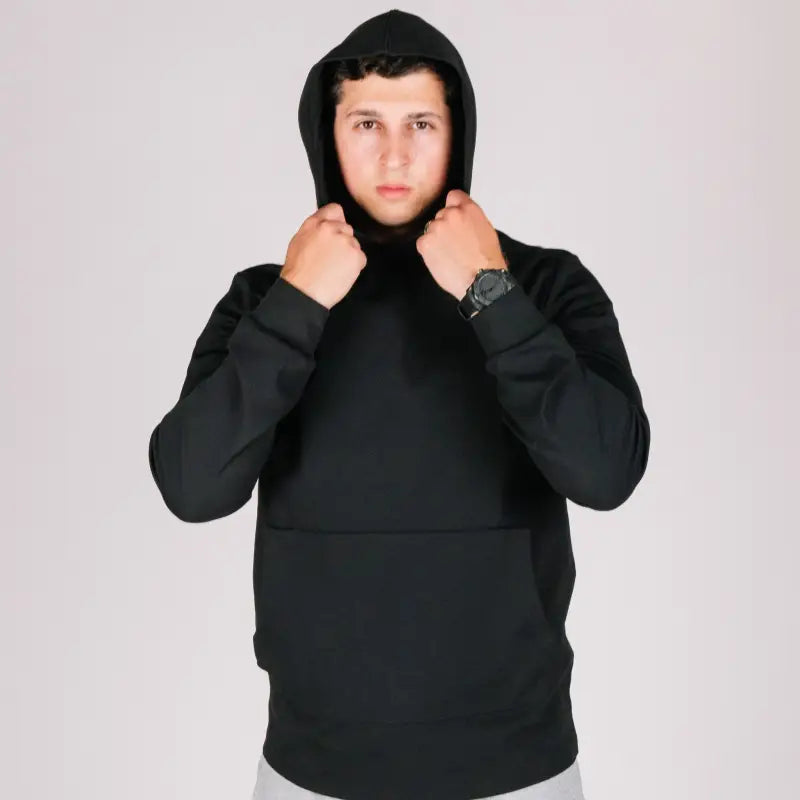 Durable concealment hoodie featuring a black hooded sweatshirt with hand pocket and smooth draws
