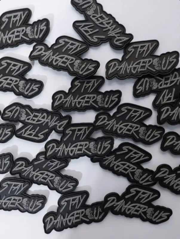 Stay Dangerous PVC patch featuring graffiti-style lettering for gear and vests