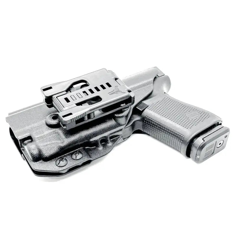 Black Glock 19 pistol in holster with Streamlight TLR-7 and magazine pouch by Four Brothers Holsters