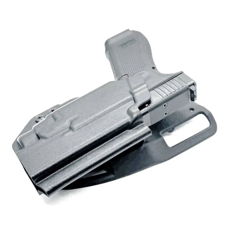 Black Glock 17 pistol with Streamlight TLR-7 HL-X in holster for duty or competition