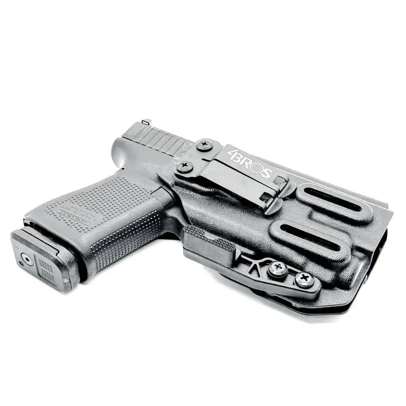 Black Glock 19 pistol in an IWB holster with magazine pouch for concealed carry