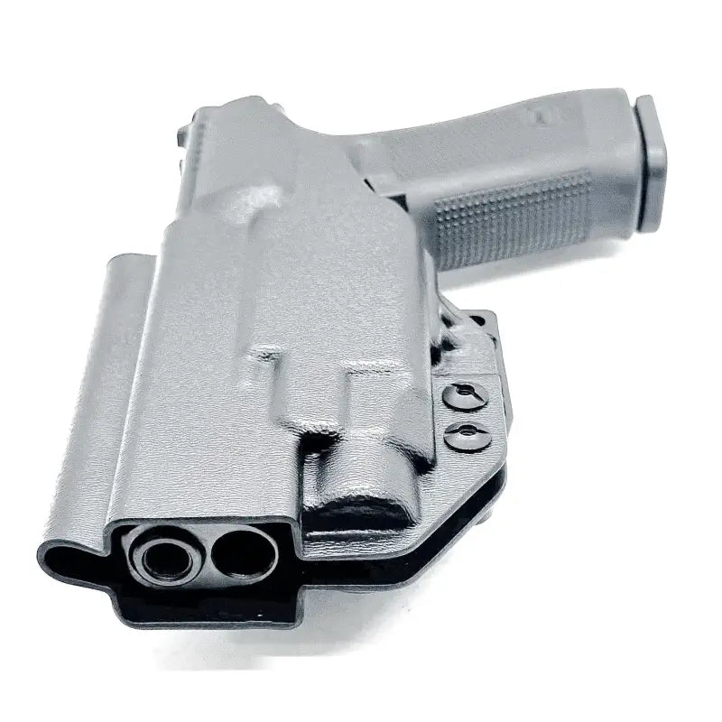 Black Glock 17 holster with TLR-7 HL-X light mounted and secure retention