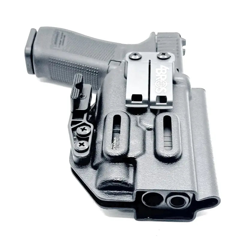 Black Glock 17 holster with magazine carrier and TLR-7 HL-X light mounted, secure retention