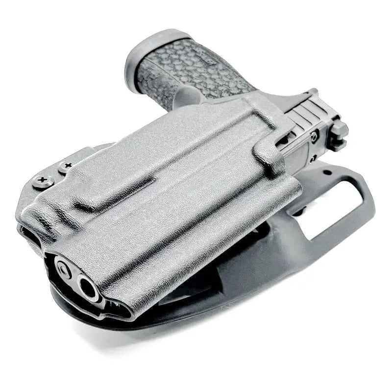 Sig Sauer P365-FUSE pistol with TLR-7 weapon-mounted light in holster on white background