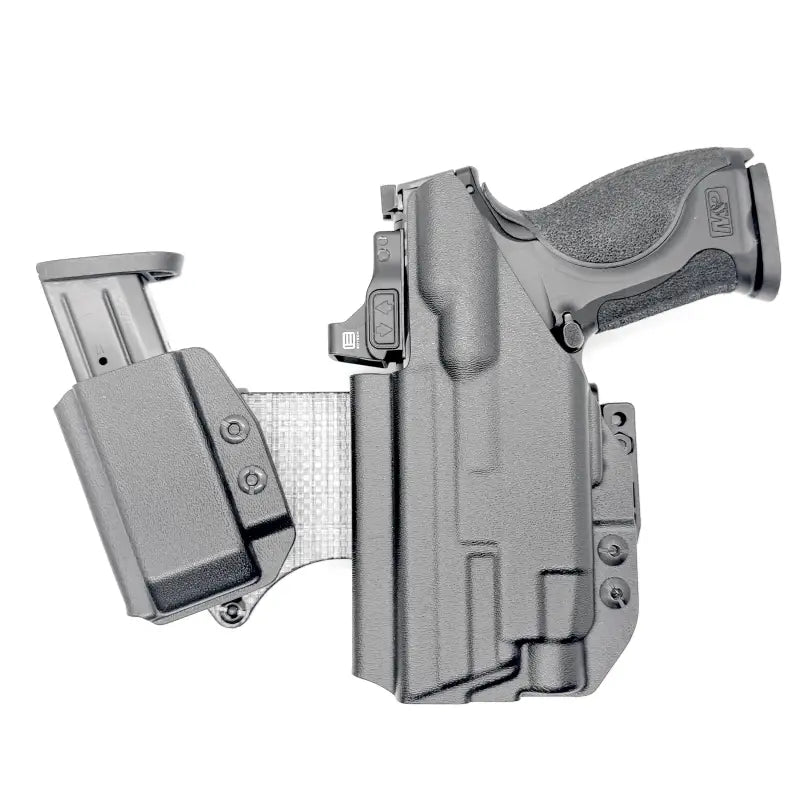 Black pistol and magazine in holster on 4BROS Fat Guy’s Appendix Rig with magazine carrier