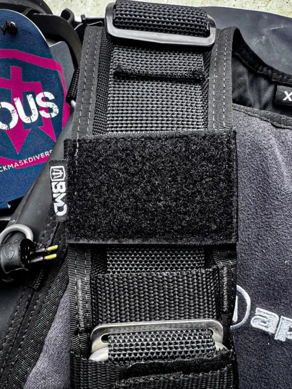 Black scuba diving BCD with solas tape and slap strap, ideal for first responders