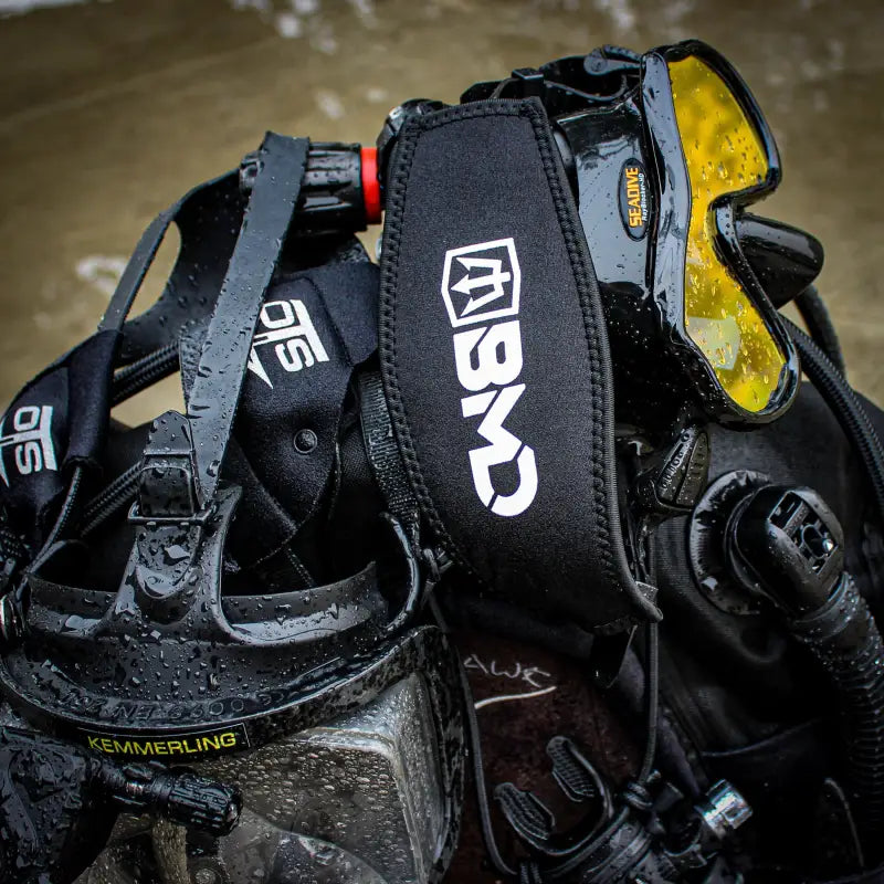 Black scuba diving gear featuring the BMD Mask Strap for secure mask strap fit