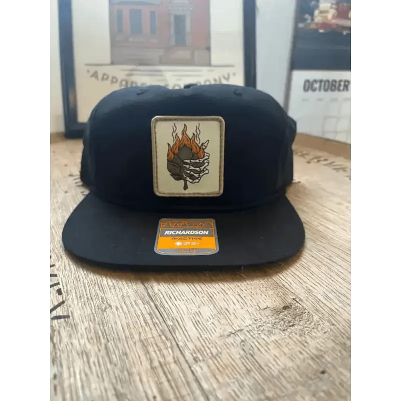 Black snapback hat with flaming skull patch from Smokin Hop Brewery collection