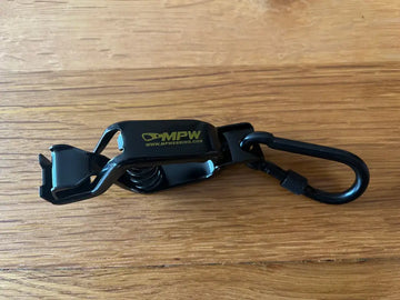 Black spring-loaded metal glove holder with carabiner for first responders and high-grade durability