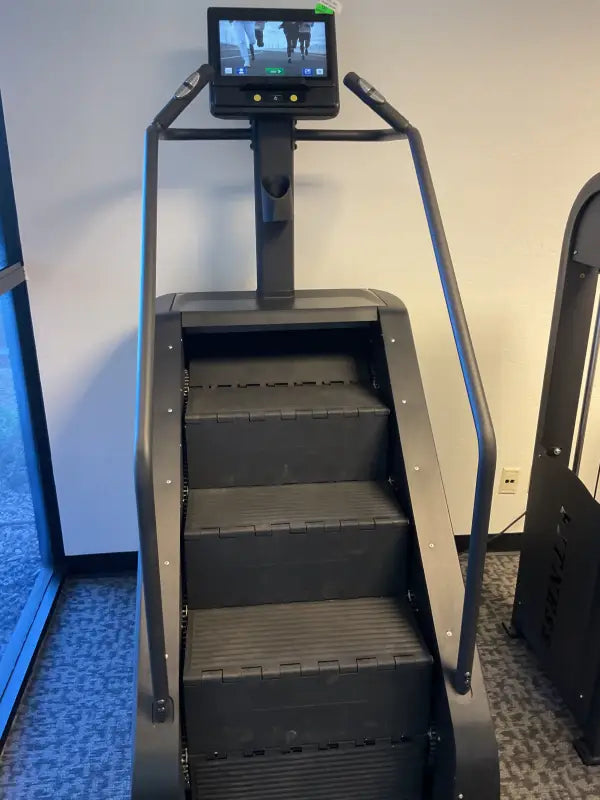 Black SFE Stepmill Pro with revolving staircase for a natural climbing motion workout