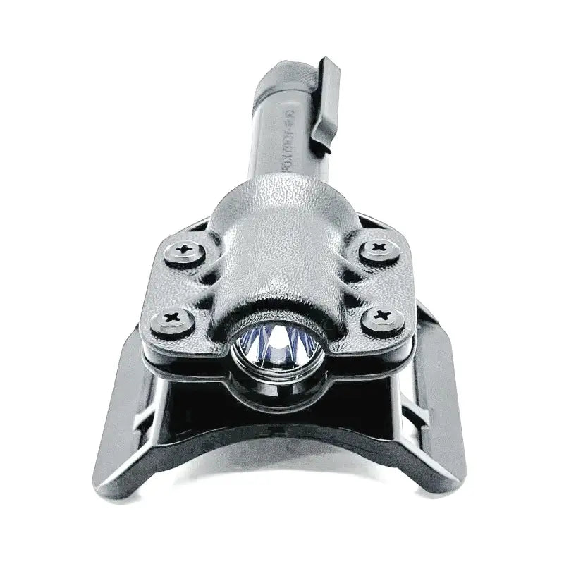 Black tactical flashlight with LED emitter mounted on Sig Sauer flashlight carrier with Safariland QLS fork