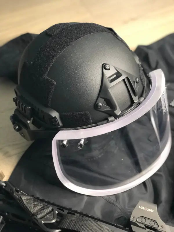 Black tactical helmet with face shield for Body Armor by Redemption Tactical