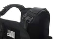 Black tactical plate carrier with quick-release shoulder buckle from Redemption Tactical featuring a standard 10x12 plate