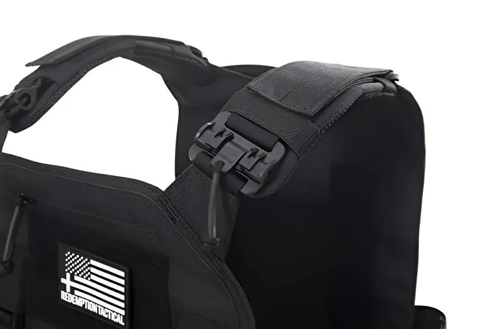 Black tactical plate carrier with quick-release shoulder buckle from Redemption Tactical featuring a standard 10x12 plate