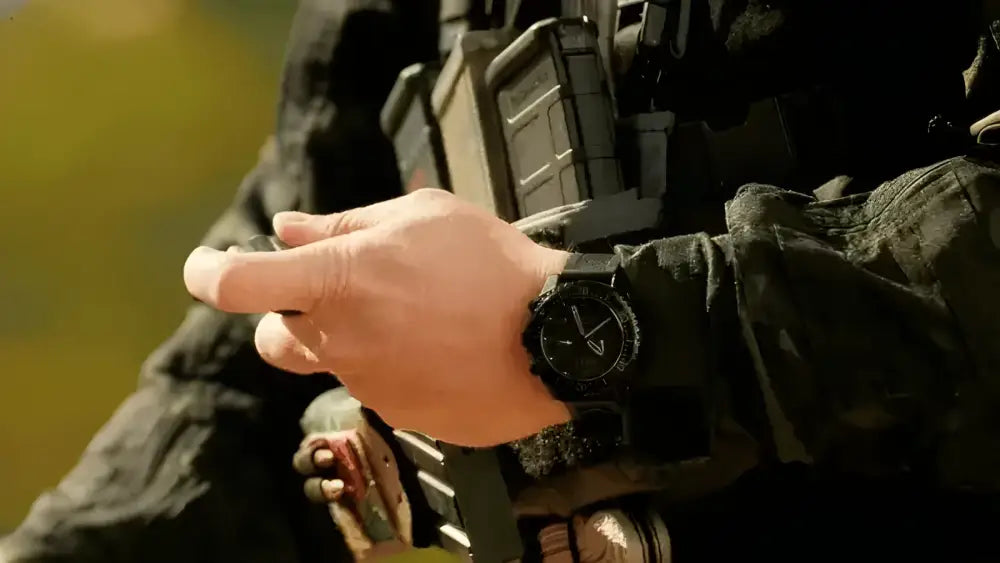 Black tactical wristwatch paired with military gear in B1 Multicam Complete Kit