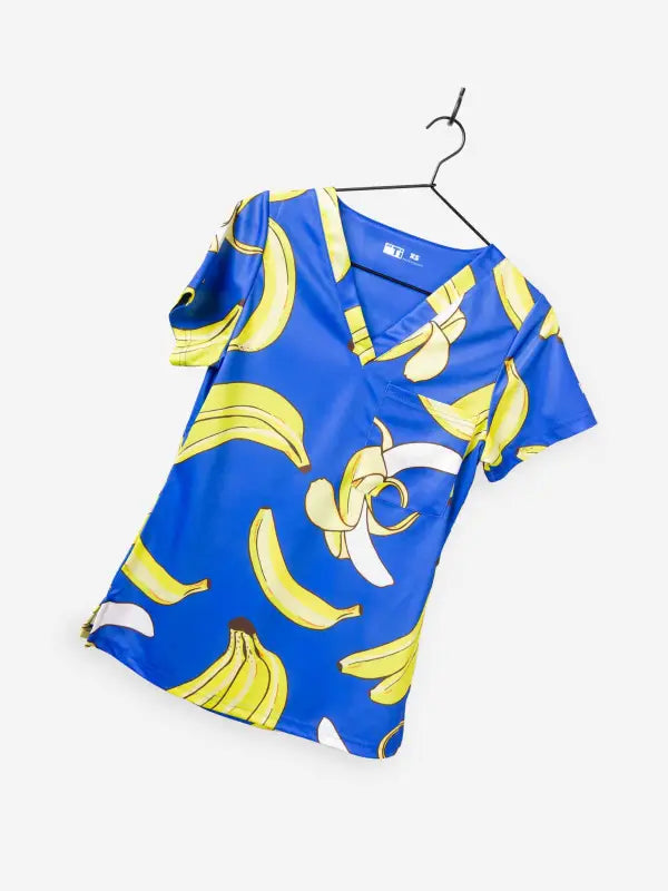 Blue Women’s Gone Bananas Scrub Top with yellow banana print for first responders