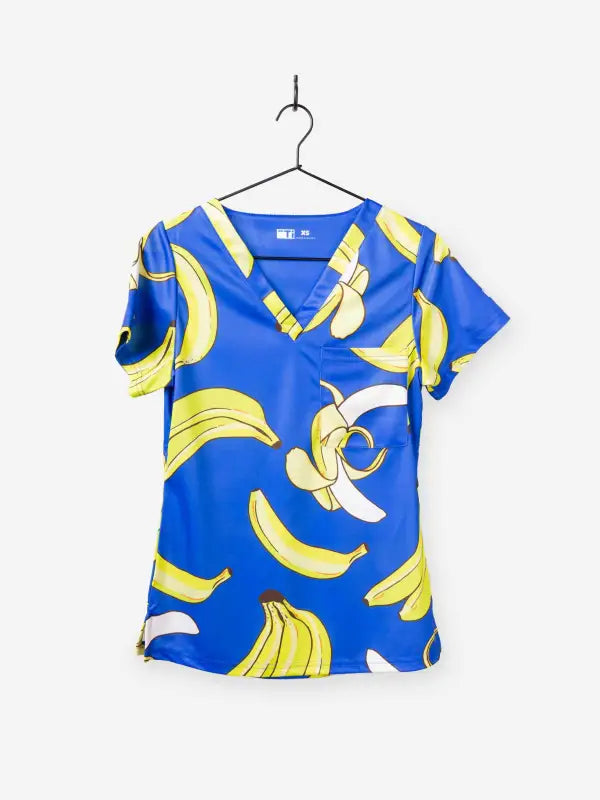 Blue women’s Gone Bananas Scrub Top with yellow banana print for first responders