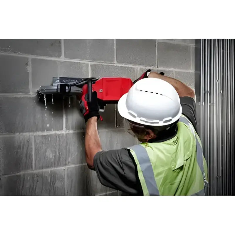 Construction worker using Milwaukee M18 Fuel™ 9-inch cut-off saw, One-Key™ bare tool