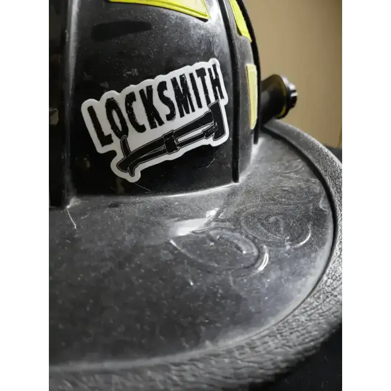 Dusty black firefighter helmet with locksmith helmet decal in durable vinyl for protection