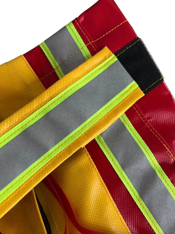 Firefighter gear with reflective stripes showcasing Standard BlitzFire Firefighting Nozzle Cover, a weather nozzle cover for safety