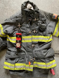 Firefighter’s gray turnout coat with THE MINIMALIST Leather Inverted flashlight holder