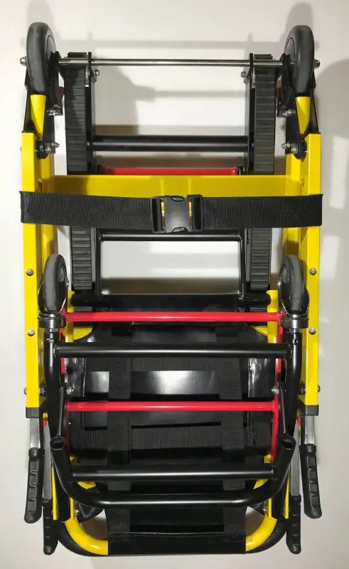 Folded yellow emergency evacuation stair chair with wall bracket for quick rescue
