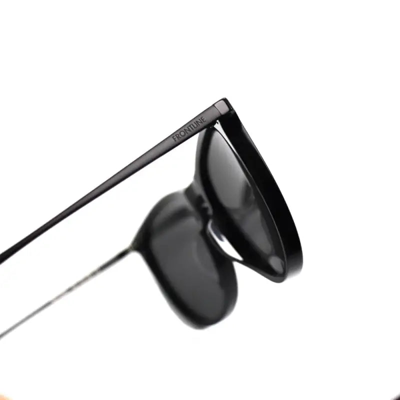 Black Glorietta sunglasses with thin frames, featuring free lens design, side view