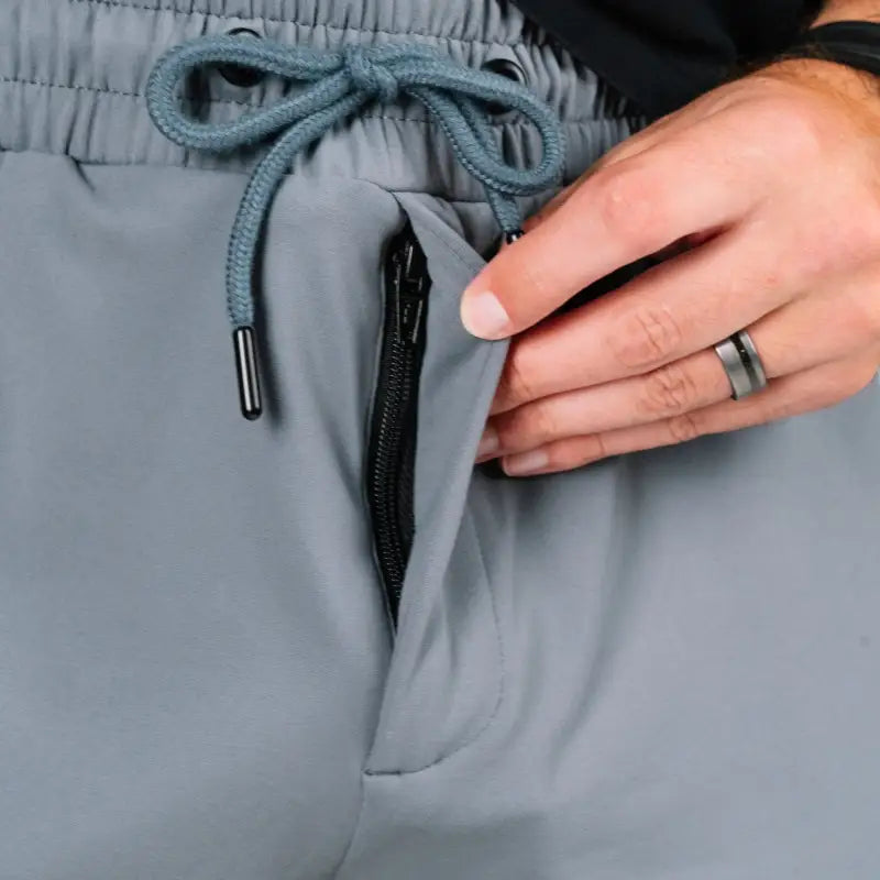 Gray athletic pants with zippered pocket from Carrier Shorts Mk.II for concealed carry