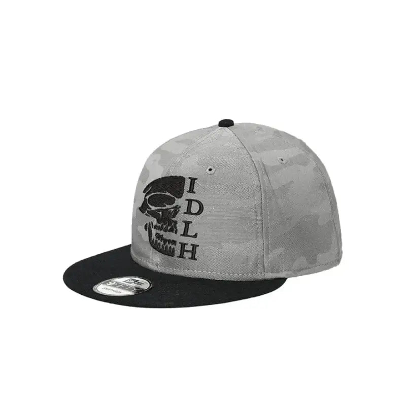 Gray and black snapback baseball cap featuring New Era Grey Camo Snap OG Skull logo design