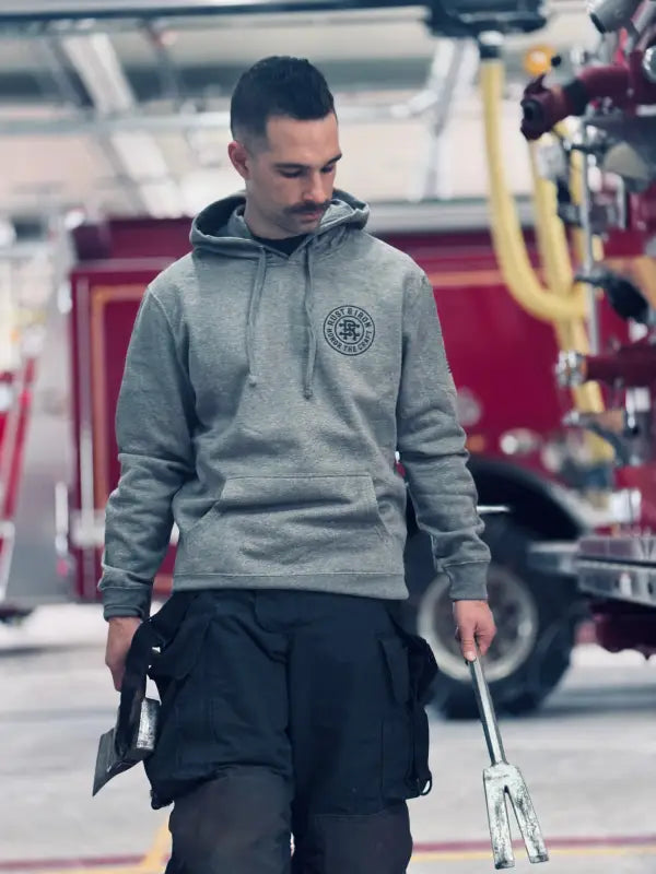 Gray hooded sweatshirt featuring the Deck Gun Hoodie made from combed ring spun fabric