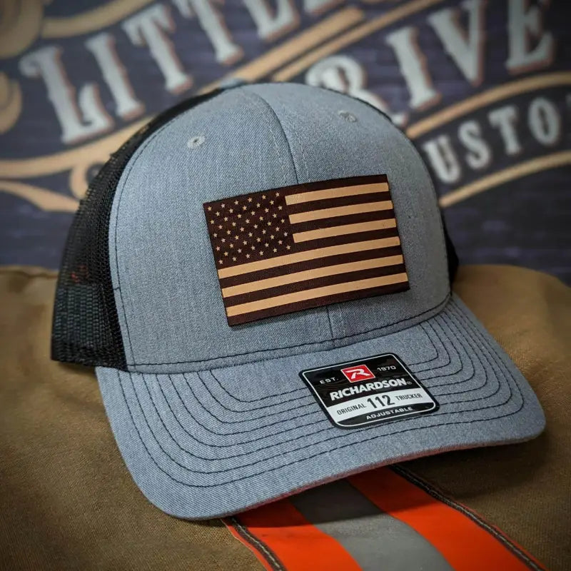 Gray trucker hat with leather patch and wooden American flag for all head sizes