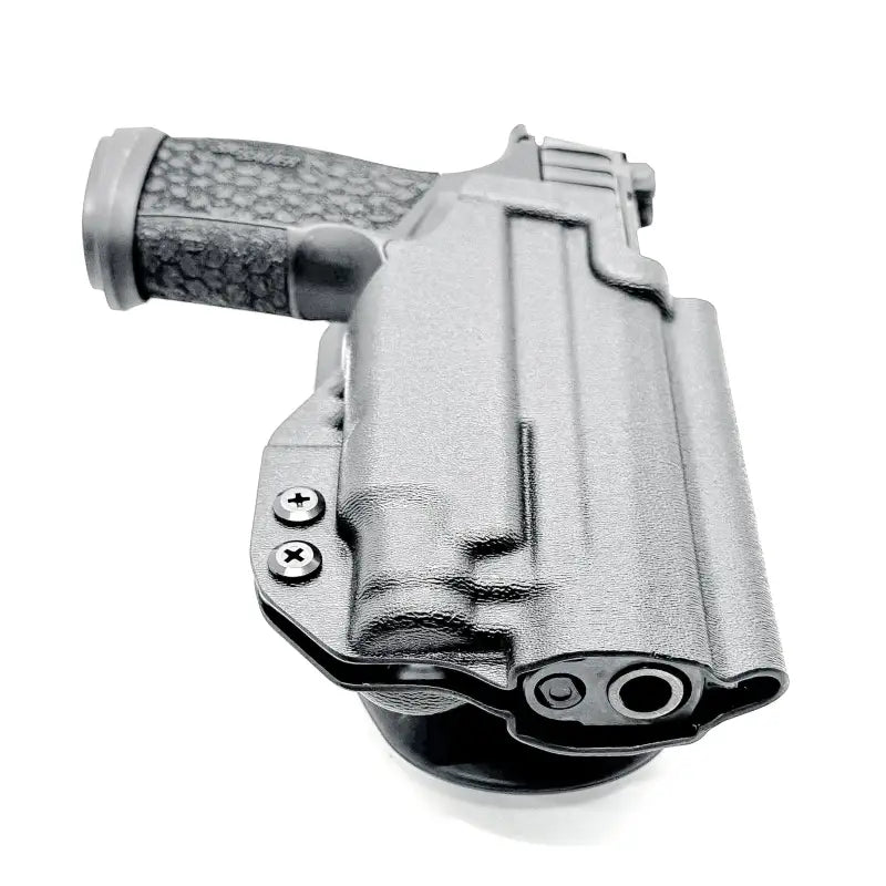 Sig Sauer P365-FUSE handgun secured in black polymer holster with weapon-mounted light