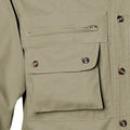 Khaki utility pocket with snap buttons on Left-Hand Hunter Shirt for Men, features quilted shooter patch