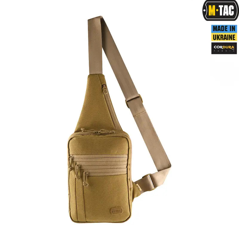 Tan M-Tac Concealed Carry Sling Bag Elite Gen.IV with adjustable strap and zippered compartments