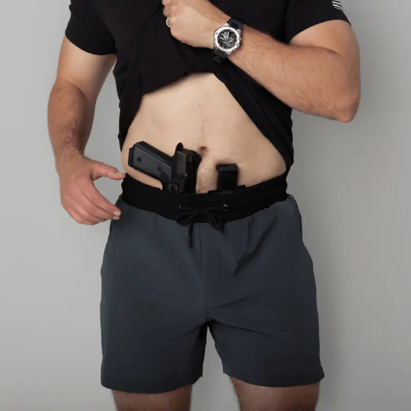 Man wearing Carrier Training Shorts Mk.II for concealed carry and training purposes