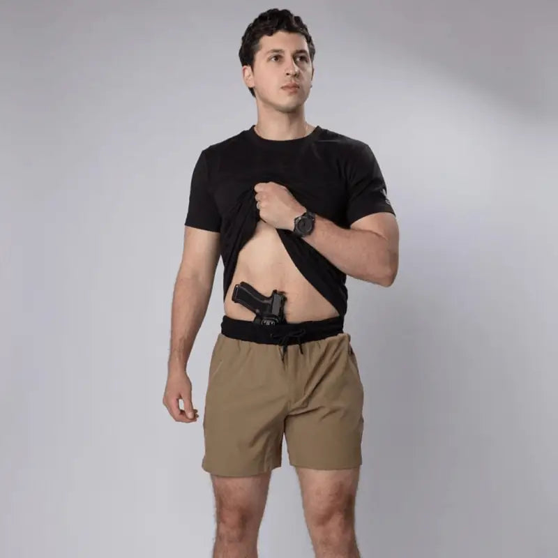 Man wearing Carrier Training Shorts MK.II with concealed carry for tactical training