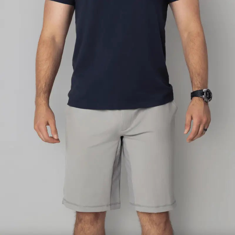 Man wearing gray Carrier Shorts Mk.II with concealed carry design by Arrowhead Tactical Apparel