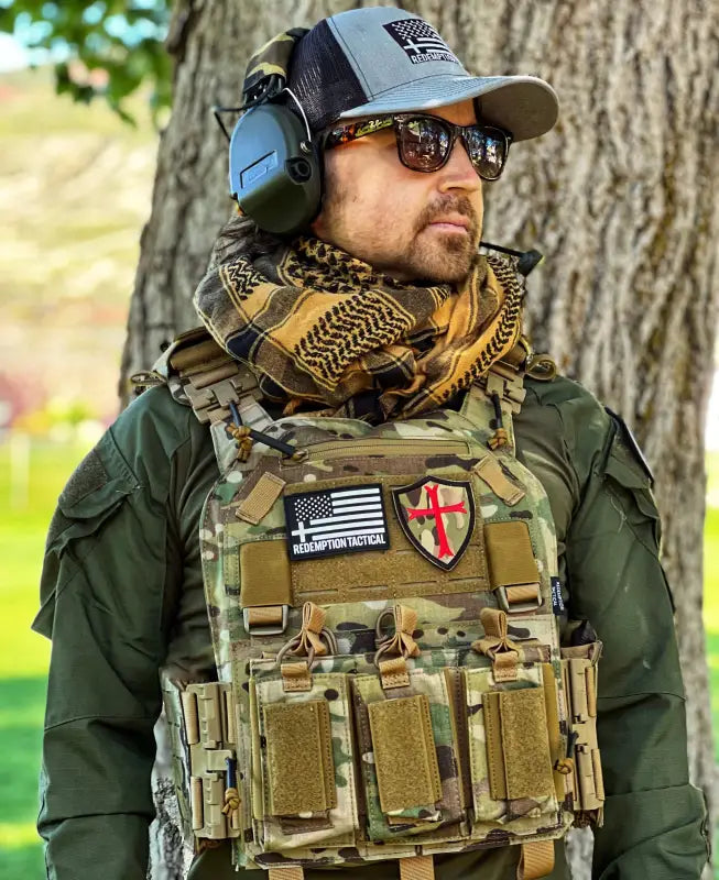 Man in tactical gear wearing Redemption Tactical Crusader 2.0 plate carrier vest with standard 10x12 plate