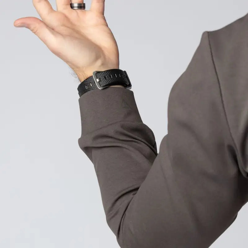 Man’s arm with watch and ring in a Durable Concealment Hoodie showing hand pocket and smooth draws