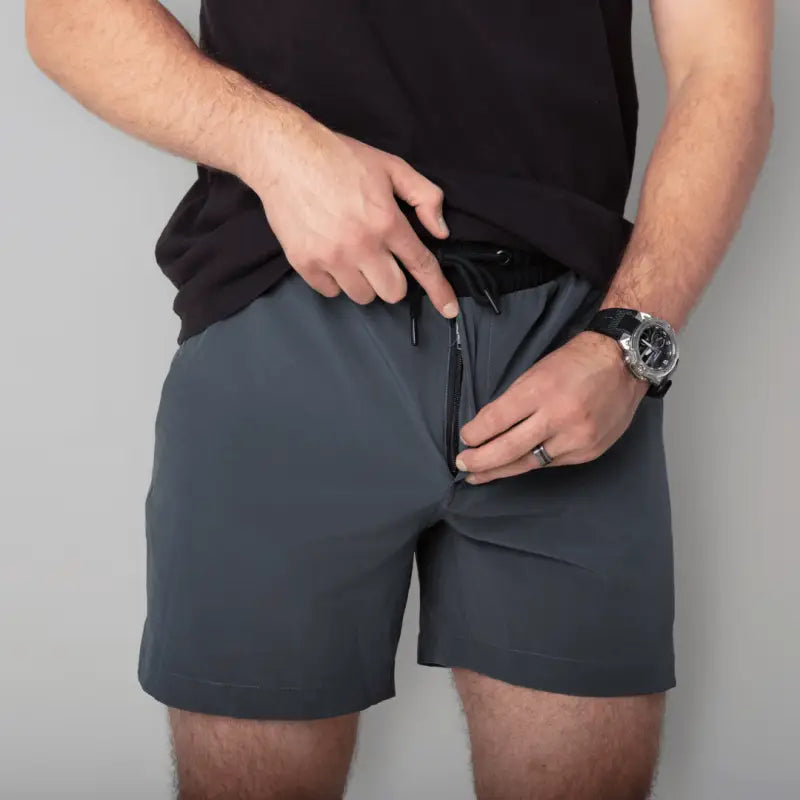Man’s gray Carrier Training Shorts Mk.II with concealed carry 5-inch inseam