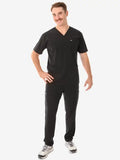 Black v-neck Men’s Five-Pocket Scrub uniform with matching pants and gray sneakers