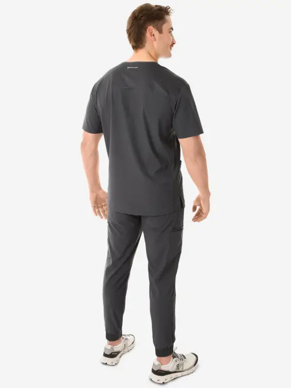 Dark gray men’s five-pocket scrub uniform with short sleeves and tapered pants